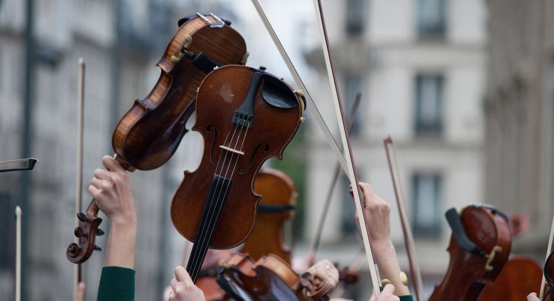 People holding violins