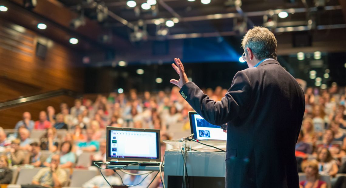 Man giving a speech on a business conference