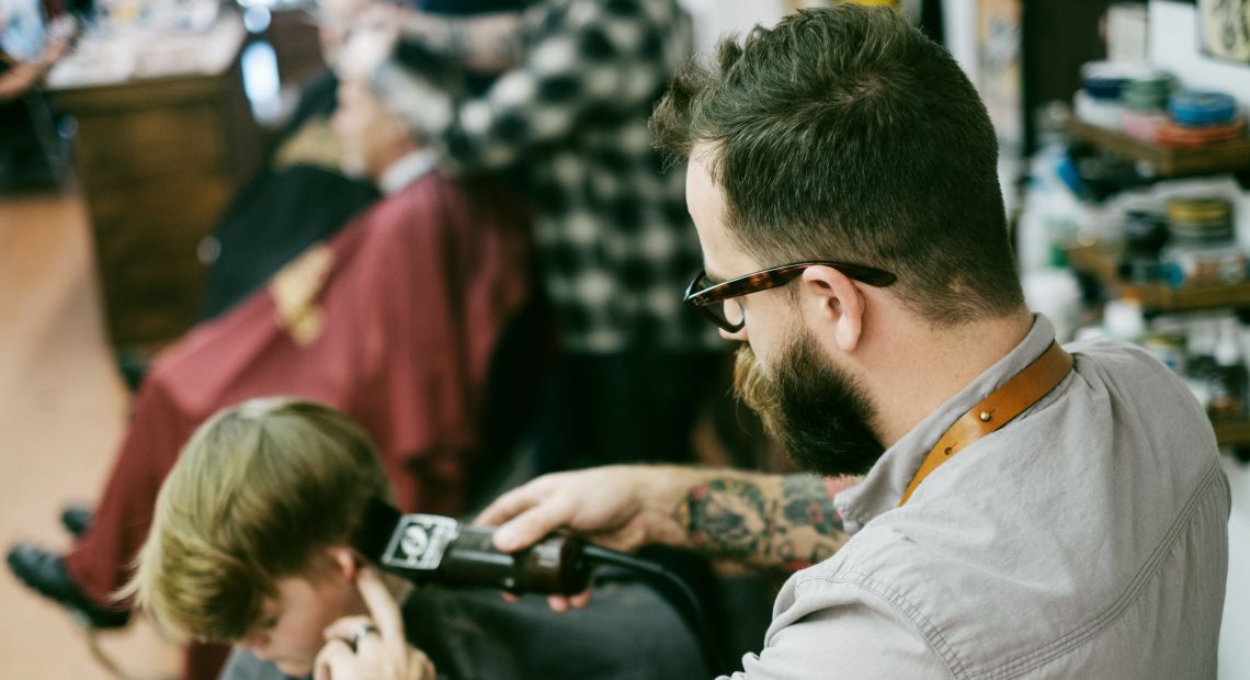 Young boy gettin a haircut