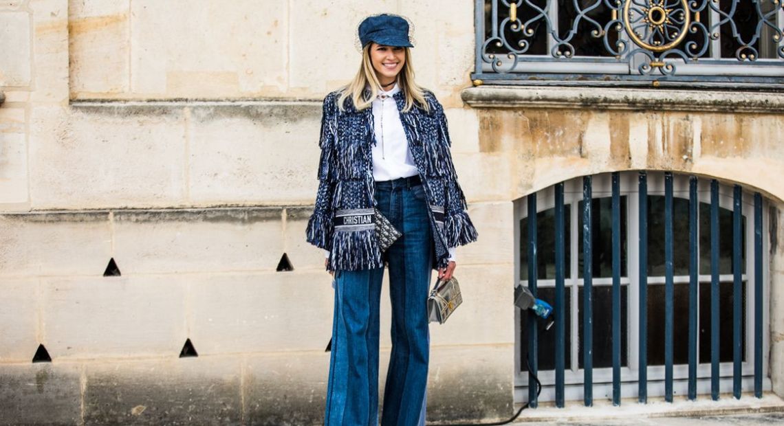 Woman in flared jeans and sequins coat