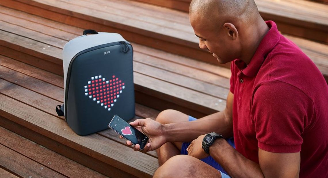 Man tuning an animated PIX backpack