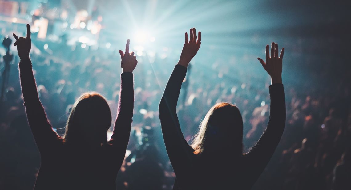 two girls in crowd at concert