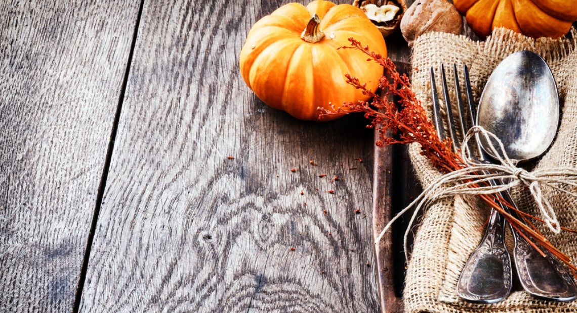 table setting with pumpkin and dry flowers