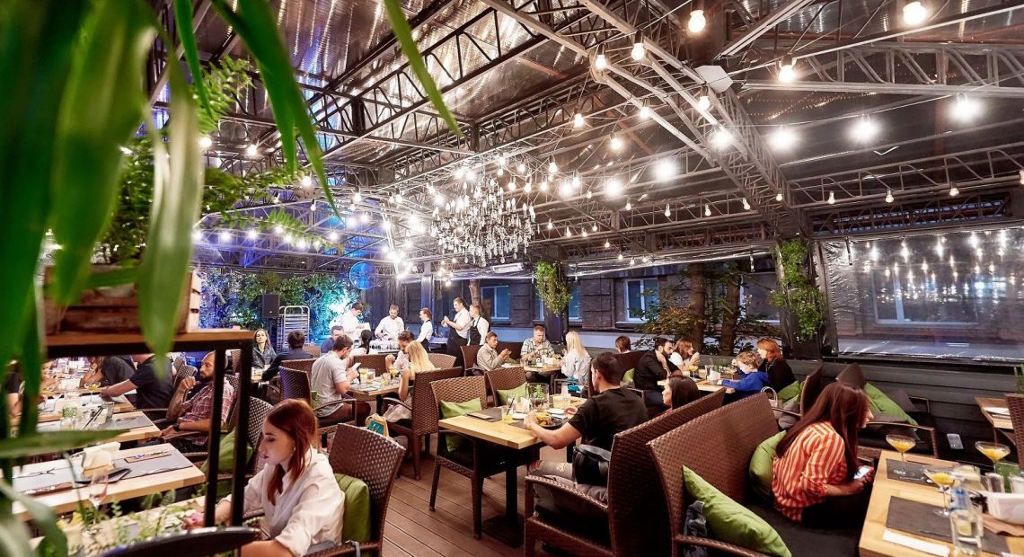 people on winter terrace of a restaurant