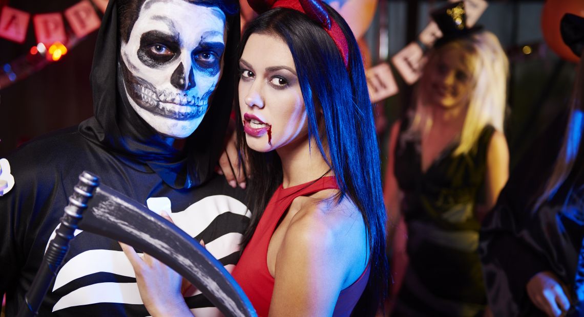 People in Halloween costumes at a party