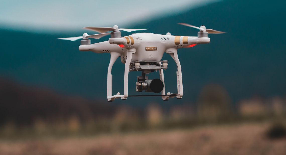 Drone flying over a field