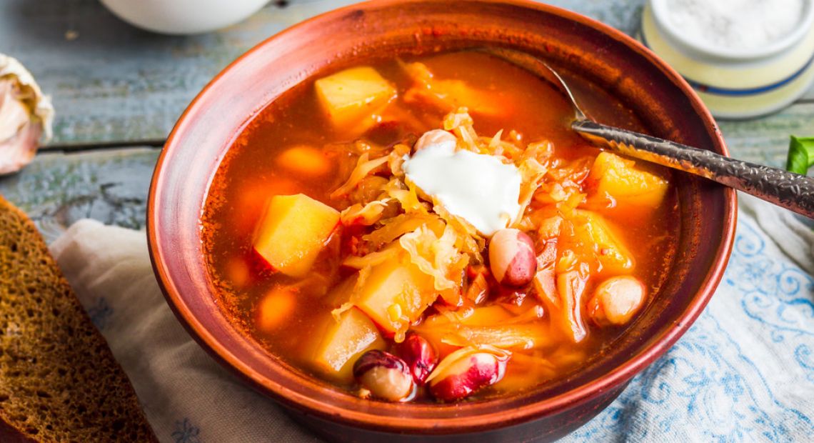 Ukrainian borsch with sour cream and bread