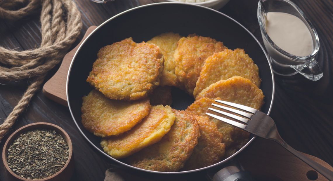 Ukrainian potato pancakes deruny with sour cream