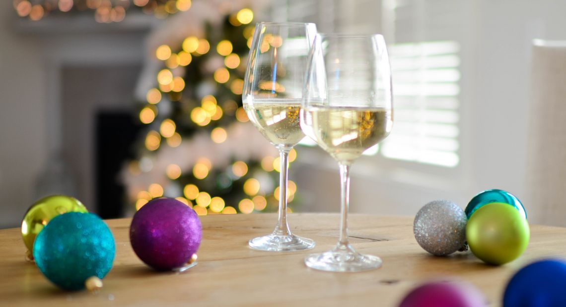 Glasses of sparkling wine and New Year decor
