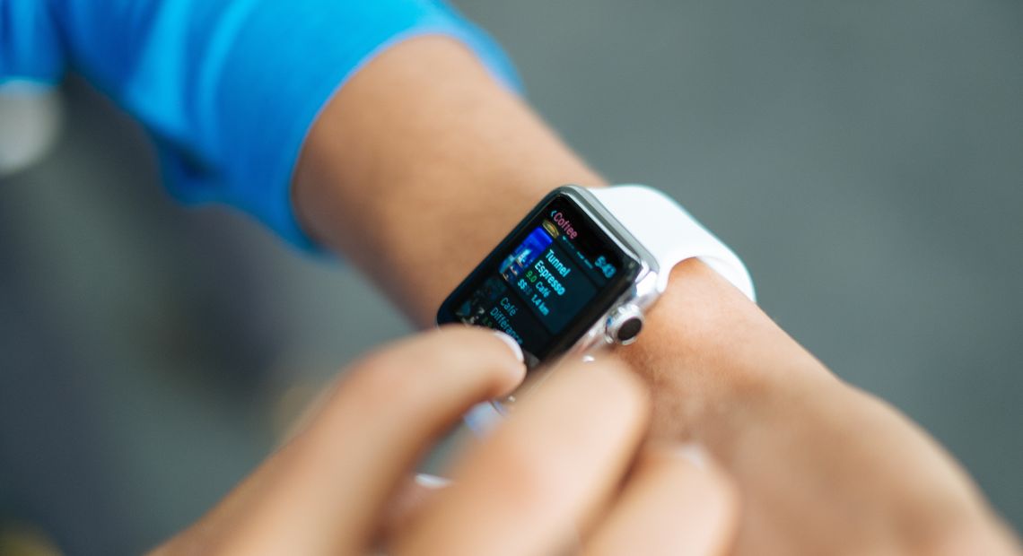 Man looking at his smartwatch