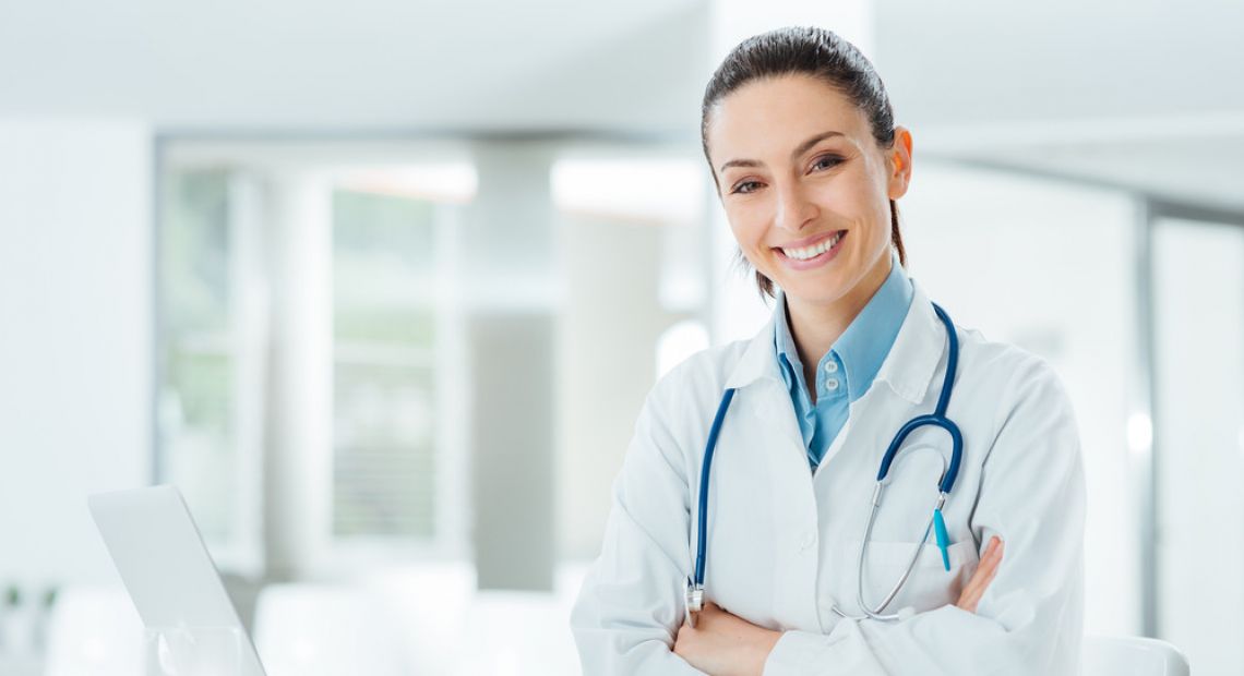 female doctor with laptop