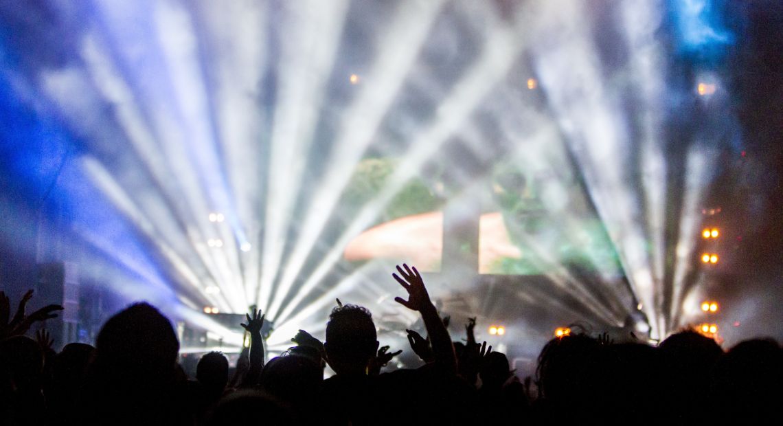 people on concert near illuminated stage