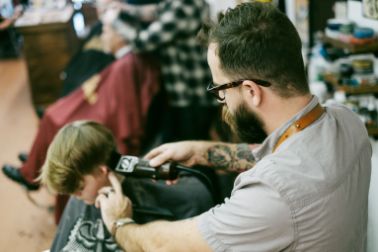 Young boy gettin a haircut