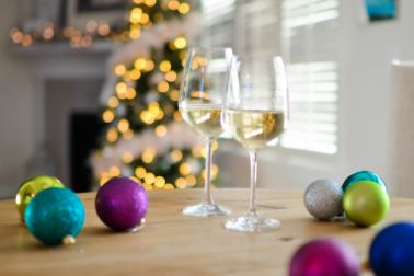 Glasses of sparkling wine and New Year decor