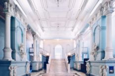 museum hall with sculptures and stairs