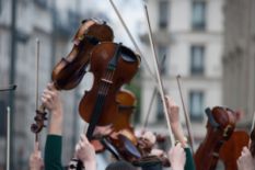 People holding violins