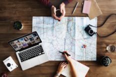 Maps, laptop and camera