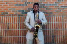 Black man playing sax