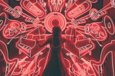Woman standing watching LED light musical instrument