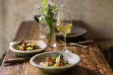 Delicious food on a stylish plate and white wine