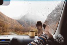 Person in warm socks on an autumn trip