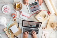 Designers working on laptop and tablet