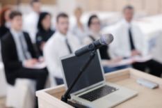Laptop and a mic on a business conference