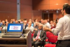 Man delivering a lecture on a business event