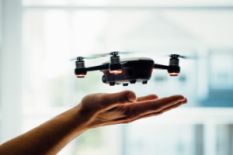 Human holding a drone