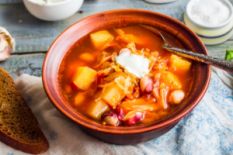 Ukrainian borsch with sour cream and bread