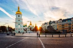 Girl running with Ukrainian flag