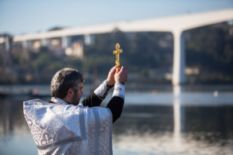 Priest blessing the water