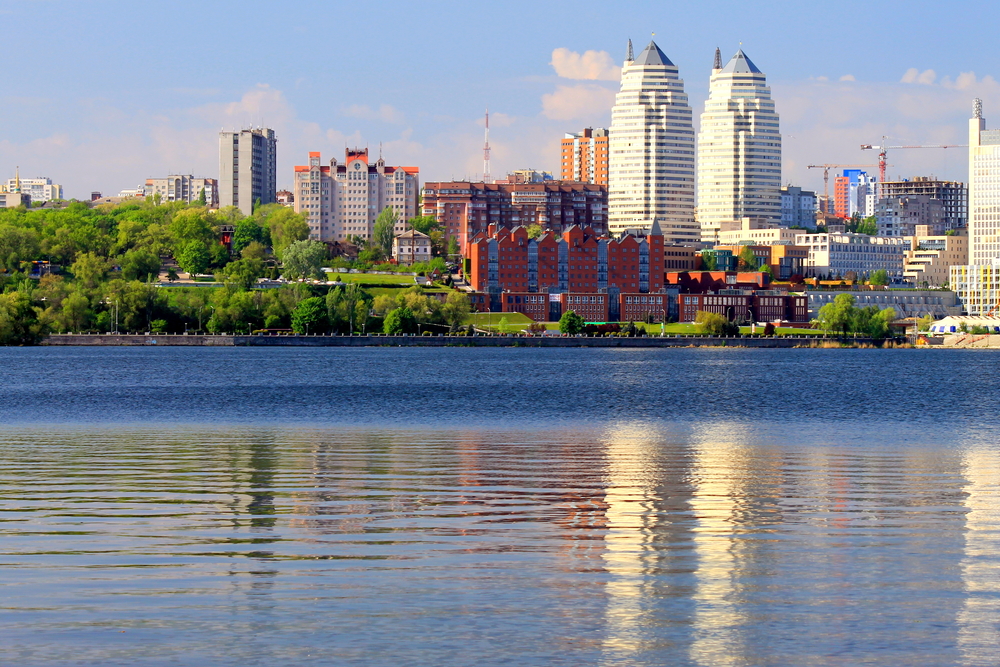 modern city buildings by river