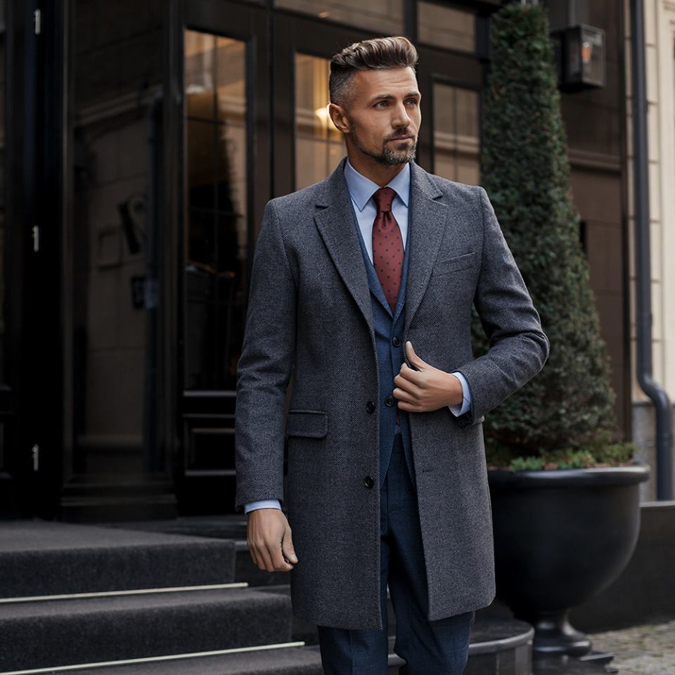 man in a grey coat