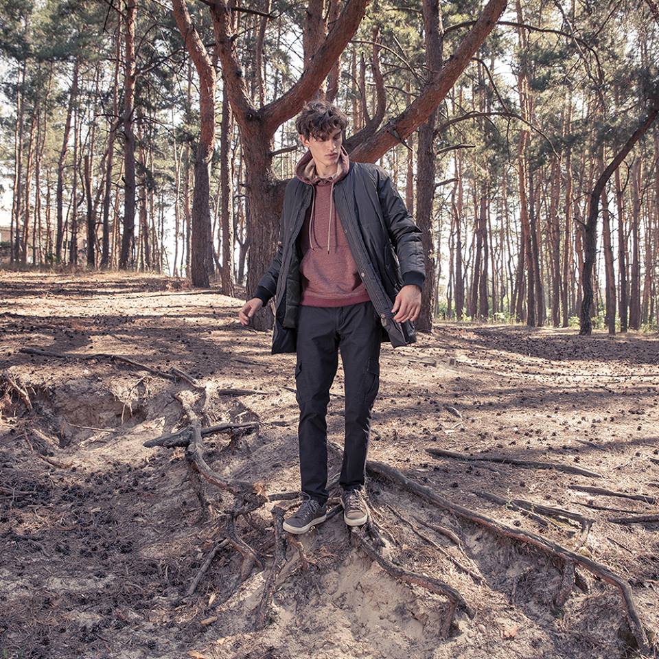 young man in a forest