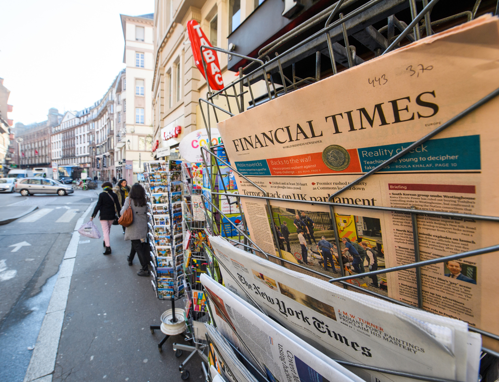 stand with newspapers and magazines