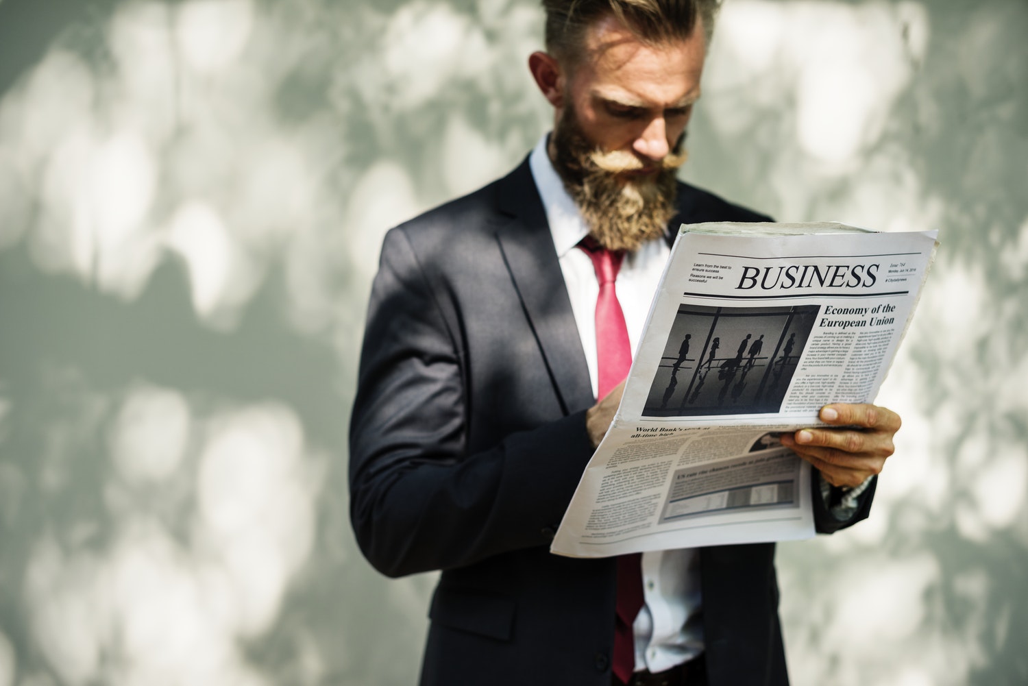businessman reading newspaper