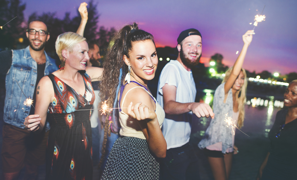 people having fun at open air party near river