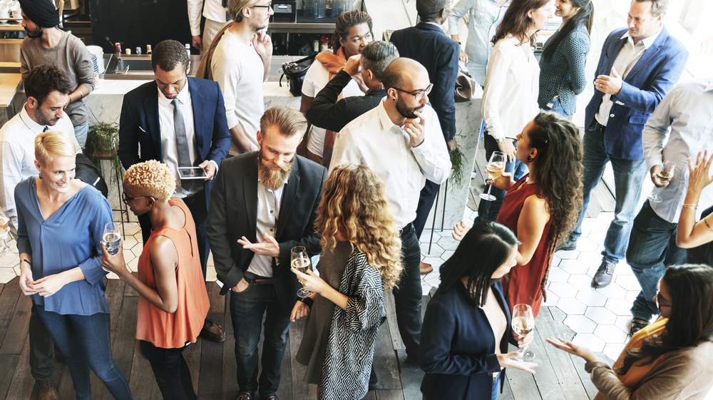 people talking and having drinks at meeting