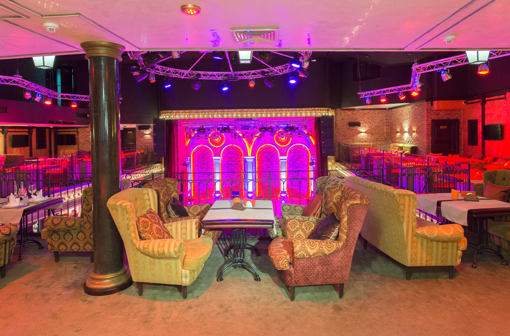 Spacious dance floor with pink lights