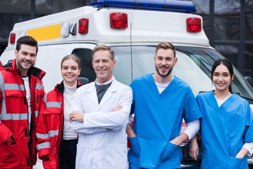 emergency brigade near ambulance car