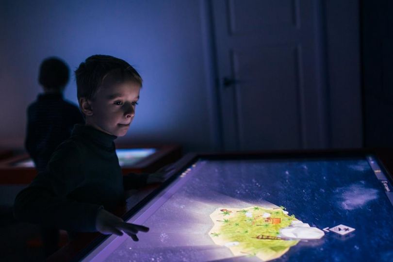Kid with an Interactive table