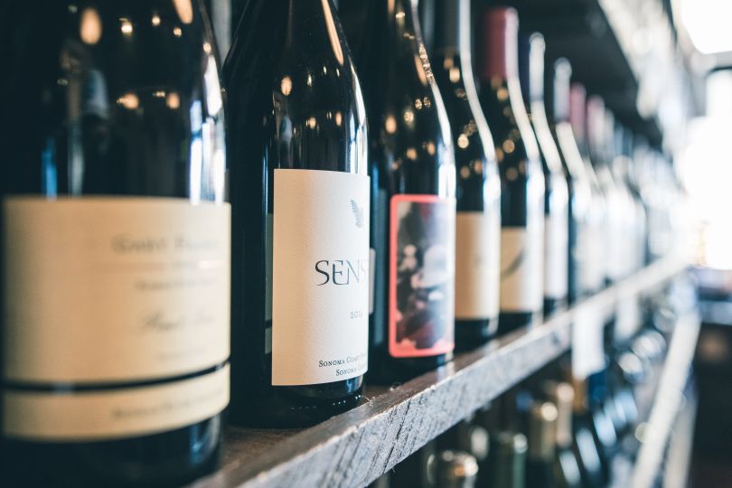 shelf with bottles of wine