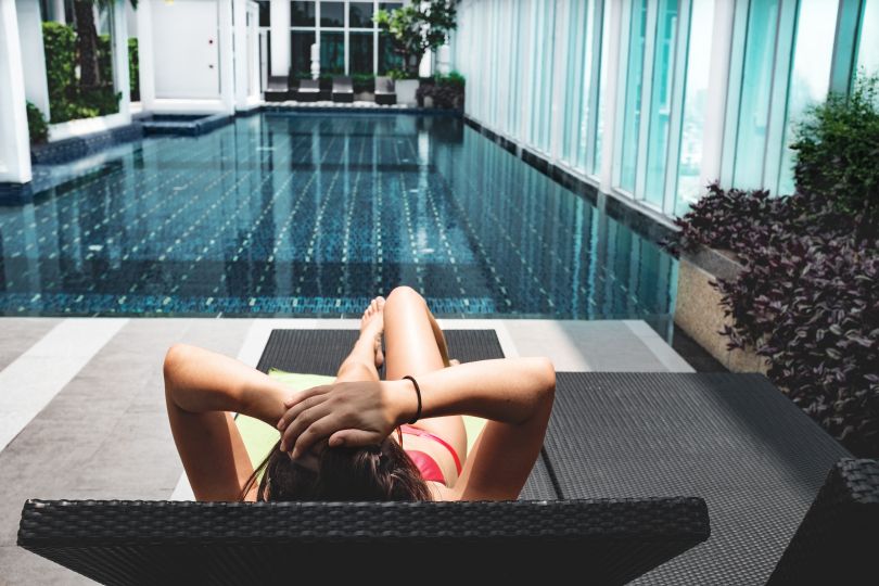 Girl relaxing near a pool