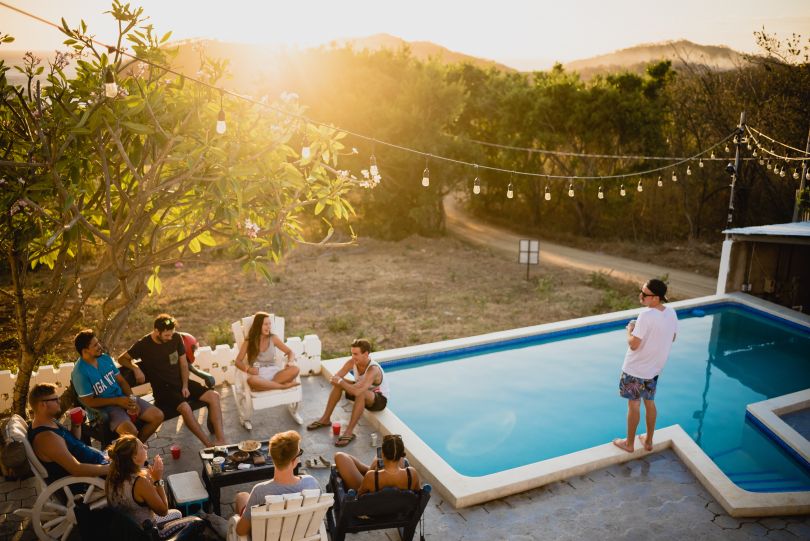 Friends having a party near the pool
