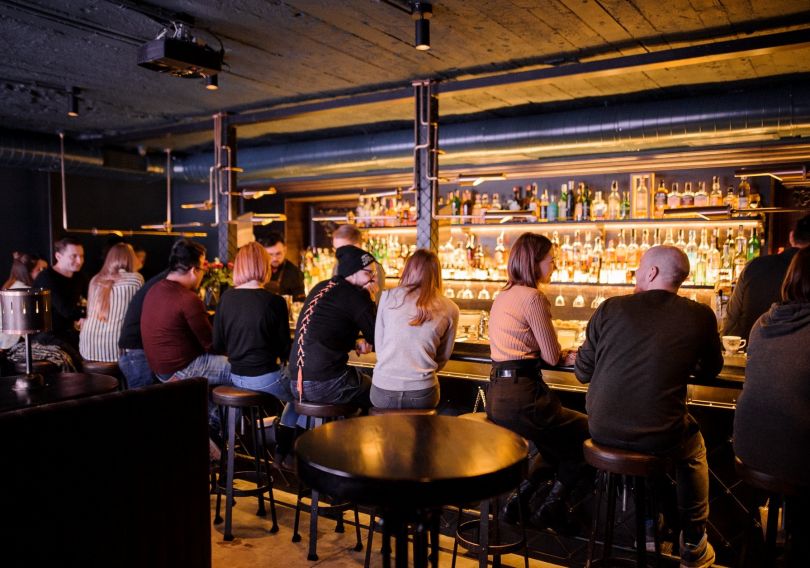 people sitting in bar at bar counter