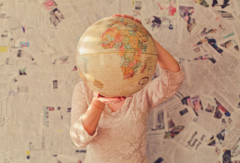 Woman holding a globe