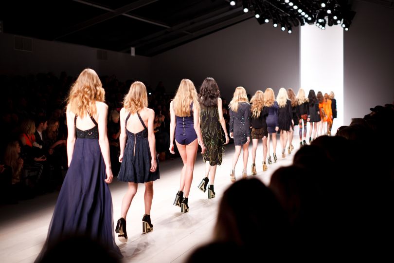 Models walking on catwalk