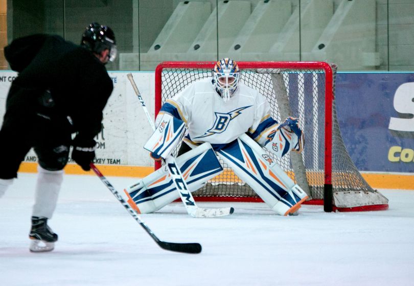 People playing hockey