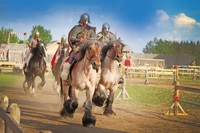 horse riders in historical costumes